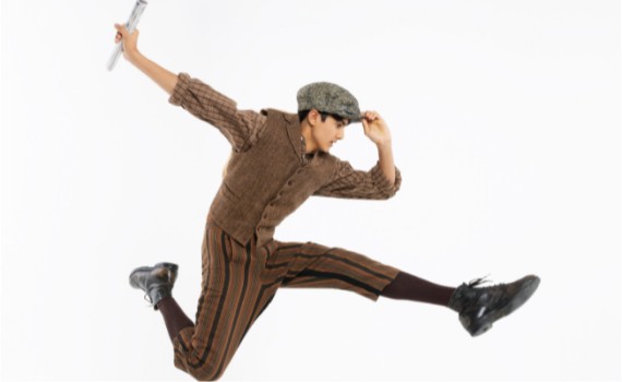 Newsie leaps through the air.