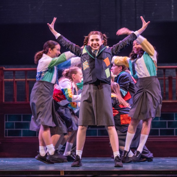 Pictured: The Company of MATILDA THE MUSICAL. Directed by: Megan Watson. Music Directed by: Sarah Richardson. Choreographed by: Stephen Cota. Set Design by: Scott Penner. Costume Design by: Lisa Wright. Lighting Design by: Jareth Li. Sound Design by: Aaron Ouellette. Photo by Dahlia Katz.