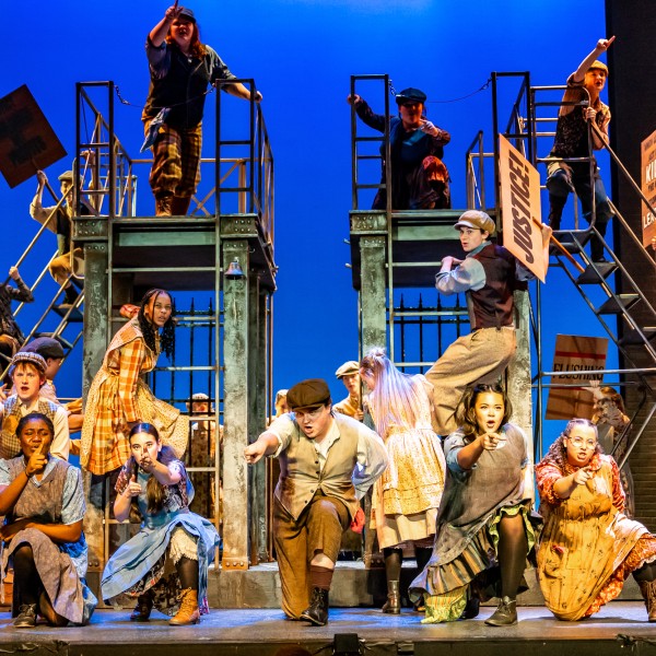 Pictured: Company members of Disney’s NEWSIES at the Grand Theatre. Directed by Ray Hogg. Music Direction by Matthew Atkins. Choreographed by Krista Leis. Set Design Consultant: Joshua Quinlan. Costume Design by Lisa Wright. Lighting Design by Echo Zhou周芷會. Sound Design by Emily Porter. Fight Director: Mike Dufays. Disability Consultant: Kristi Hansen. Stage Management by Melissa Cameron. Photography by Dahlia Katz.
