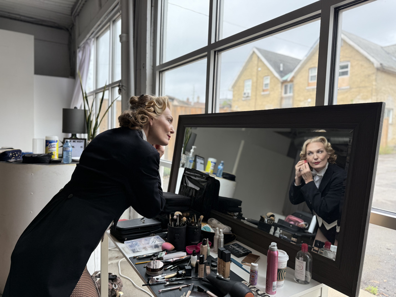 Terra C. MacLeod adds finishing touches, getting dressed to become Marlene Dietrich.