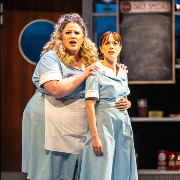 Pictured (L to R): Stacey Kay & Julia McLellan. Director: Rachel Peake. Music Director: Patrick Bowman. Choreographer: Genny Sermonia. Set & Costume Designer: Scott Penner. Lighting Designer: Michelle Ramsay. Sound Designer: Richard Feren. Fight & Intimacy Director: Siobhan Richardson. Photo by Dahlia Katz.